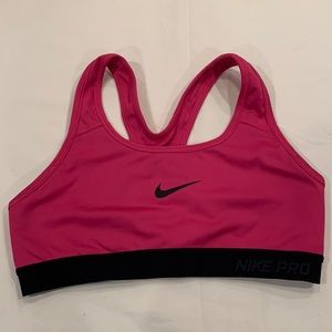 Pink and black Nike sports bra